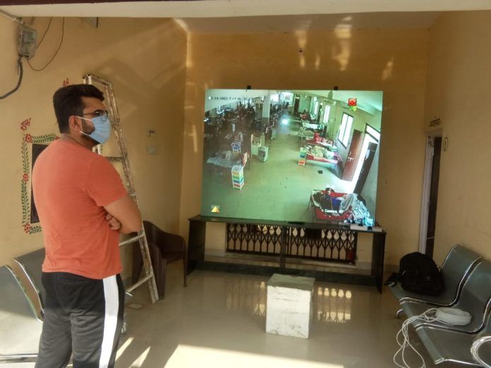 6-8 large screens placed outside the Gadhakota Covid Care Center